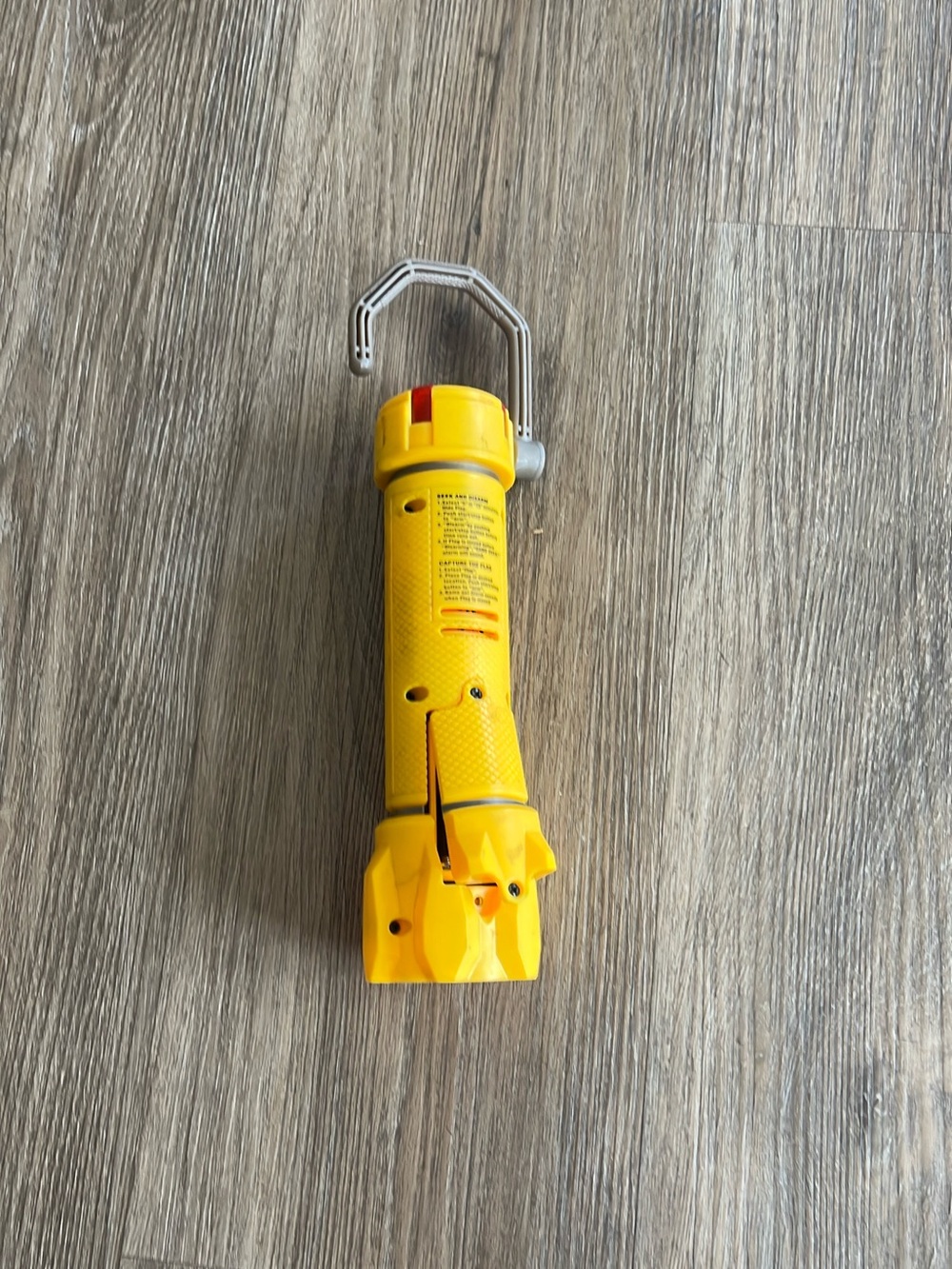 Yellow Nerf Dart Tag flashlight-style blaster with orange accents, a red indicat
